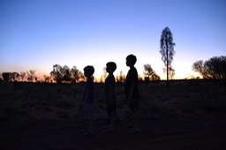 Uluru - Boys in setting sun