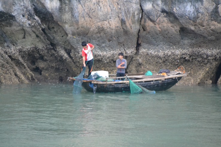 Locals fishing on Halong Bay